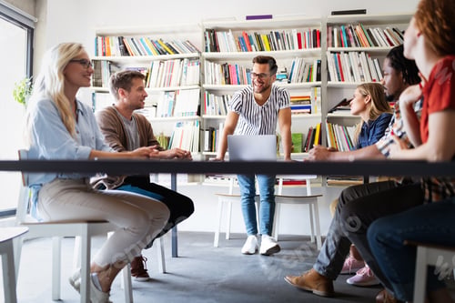 Preview: Group of successful business people designers architects in office