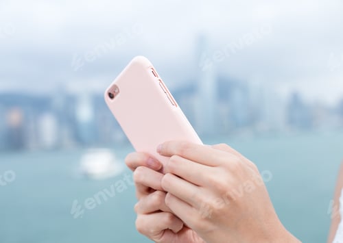 Preview: Woman use of mobile phone in Hong Kong city