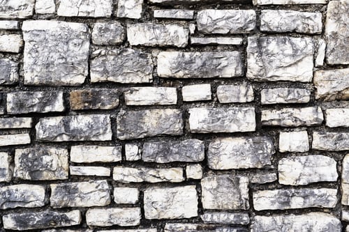 Preview: The Rough Grooved Textured Surface Of A Stone Wall For A Vintage Background Or For Wallpaper