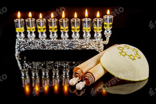 Preview: Kippah and torah for Hanukkah on menorah with burning oil candles background.