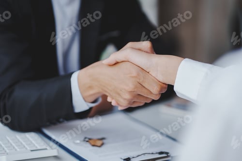 Preview: Handshake real estate agents deliver sample homes to customers. mortgage loan agreement Make a contr