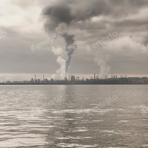 Preview: Dark smoke from oil refinery rising towards sky, at Anacortes in Puget Sound.