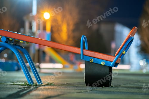 Preview: Seesaw swing in preschool yard with soft rubber flooring at night