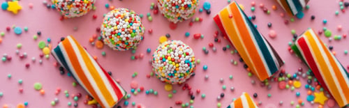 Preview: Top view of delicious sweets and sprinkles on pink background, banner