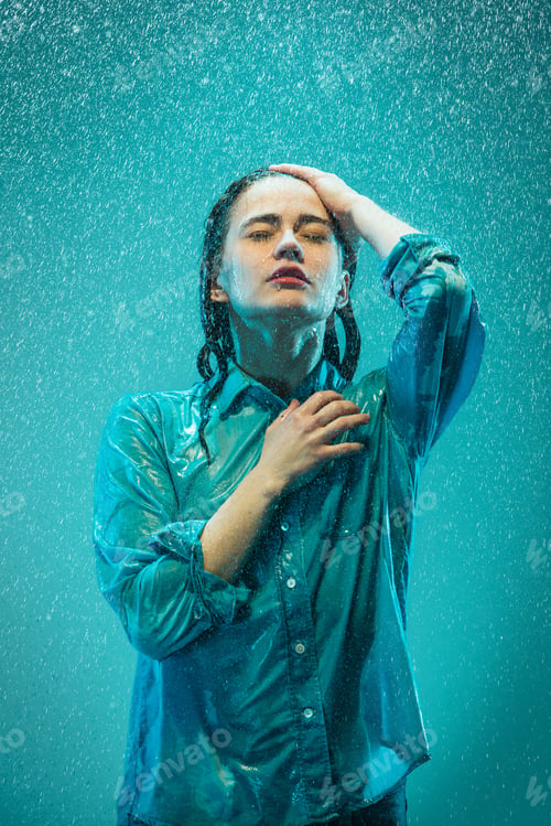 Preview: The Portrait Of Young Beautiful Woman In The Rain