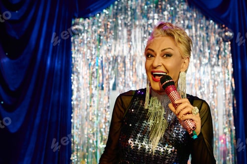 Preview: Eccentric drag queen shines on stage during an extravagant holiday performance