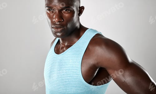 Preview: Confident young african man with muscular build