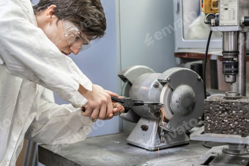 Preview: male worker use grindstone at the factory b