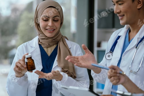 Preview: Doctor using clipboard and digital tablet find information patient medical history at the hospital.