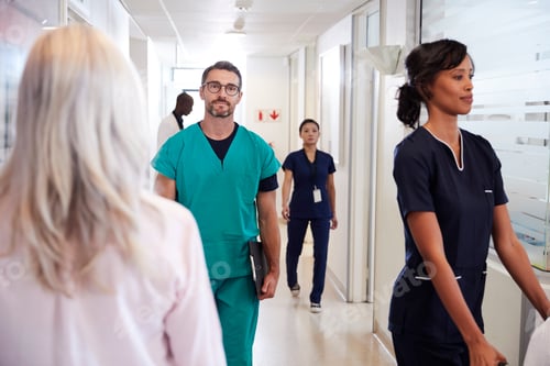 Preview: Busy Hospital Corridor With Medical Staff And Patients