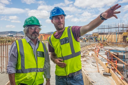 Preview: Construction worker talking to man on a construction site