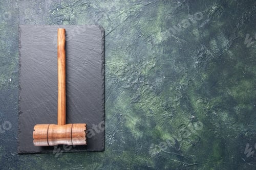 Preview: top view wooden hammer on black board on dark background kitchen color wood photo butcher meat