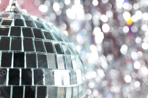 Preview: Disco ball reflects light on a pink background