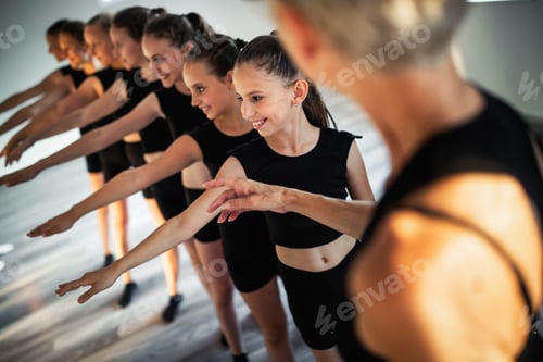 Preview: Teacher and group of children exercising dancing and ballet in dance school