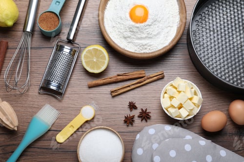 Preview: Cooking utensils and ingredients on wooden table, flat lay