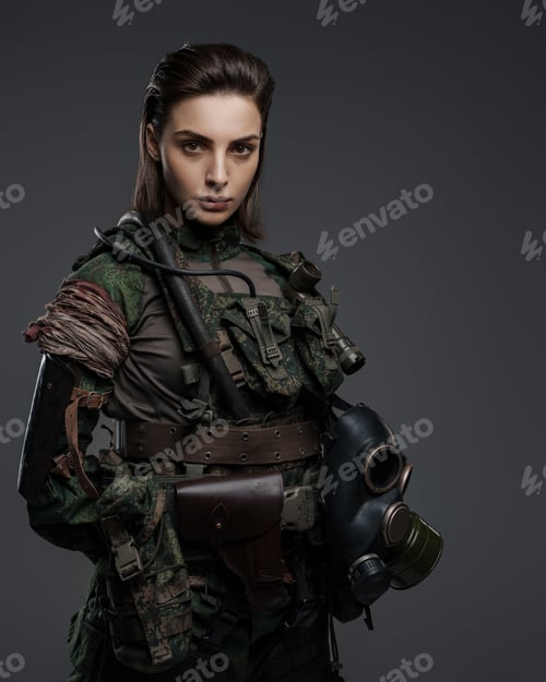Preview: Confident female soldier in military attire posing against a gray backdrop