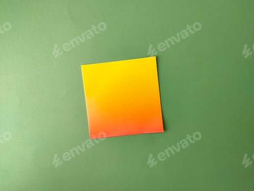 Preview: The image displays a square piece of paper with a yellow-to-orange gradient on a green background
