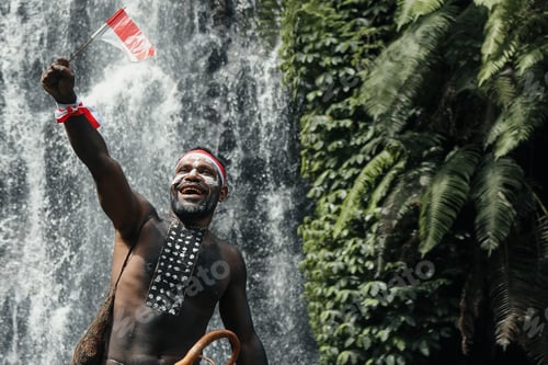 Preview: Black man from Papua tribe celebratin Indonesian Independence Day