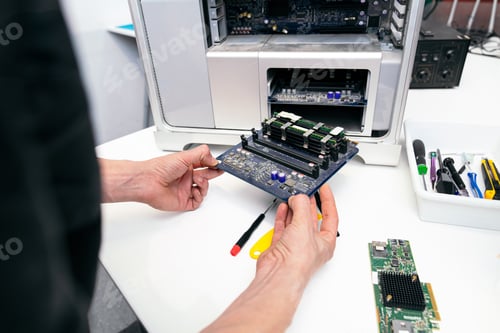 Preview: Technician Repairing RAM Module on Computer Motherboard
