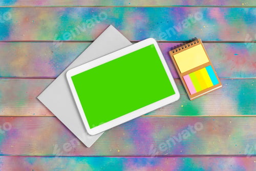 Preview: Modern blank digital tablet with papers and pen on a wooden desk. Top view. High quality