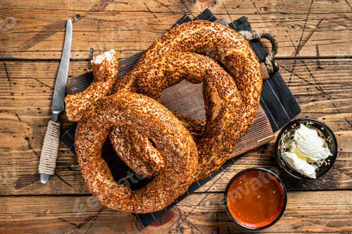Preview: Traditional turkish breakfast with Bagel Simit, kaymak and honey. Wooden background. Top view