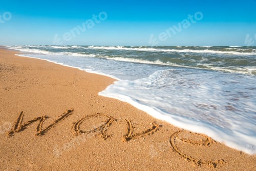 Preview: Inscription wave on the wet sand near sea