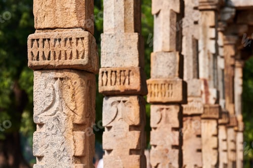 Preview: Stone columns with decorative bas relief of Qutb complex in South Delhi, India, close up pillars