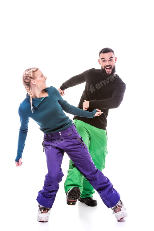 Preview: couple in snowboarding clothes having fun together isolated on white