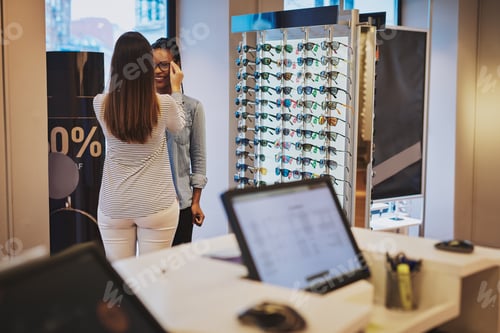 Preview: Saleslady assisting a customer in a store