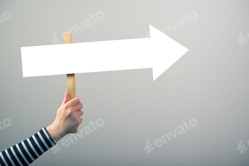Preview: Woman holding guiding direction arrow sign
