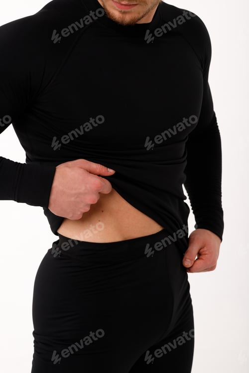 Preview: A man with a sporty physique in thermal underwear.