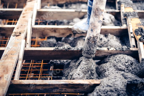 Preview: construction worker pouring cement on stairs, creating sidewalks and stairs on new building site