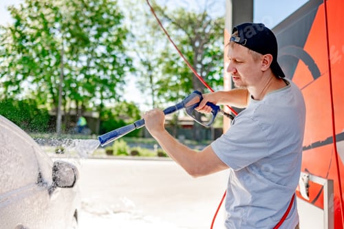 Preview: Shot of a man washing his car