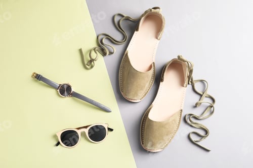 Preview: Pair of trendy women's shoes and accessories on color background
