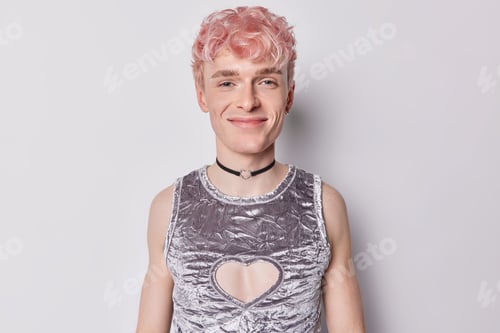 Preview: Portrait of happy satisfied young guy has androgynous gender identity wishes transition to woman