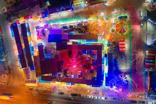 Preview: Aerial top view of amusement park in night temple fair, and local markets. People walking street