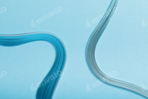 Preview: top view of blue curved abstract paper lines on blue background