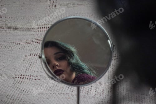 Preview: Shots of a goth girl looking at herself in the mirror