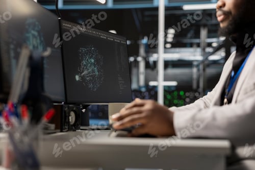 Preview: Close up of programmer in data center using AI powered tech to run simulations