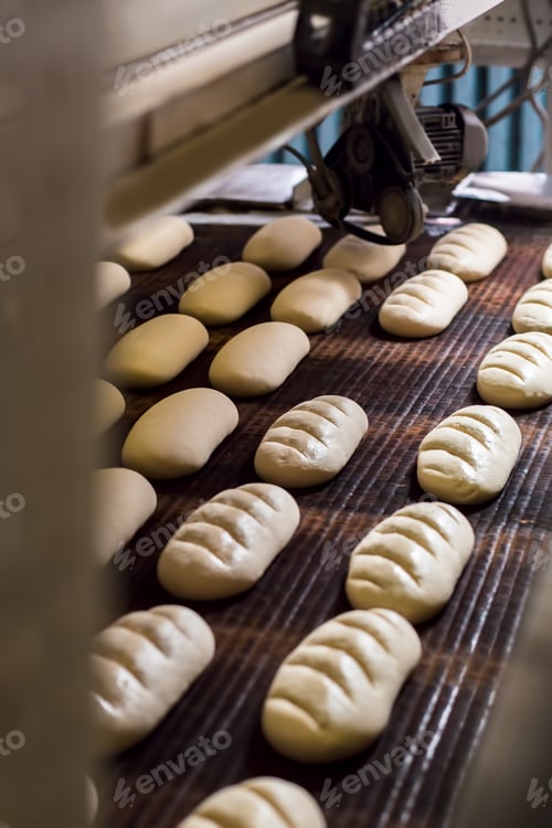 Preview: Bread dough running on conveyor belt at industrial factory.