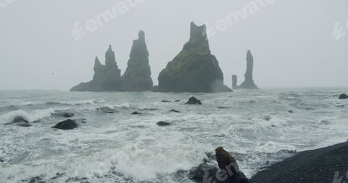 Preview: The cliffs and waves at the black sand beach, Reynisfjara in Vik, Iceland