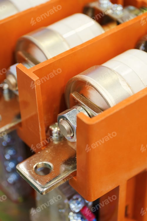 Preview: Electrical fuses installed inside an orange protective housing