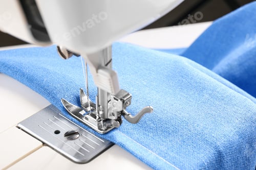 Preview: Sewing machine with light blue cloth, closeup