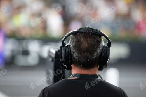 Preview: cameraman silhouette filming during event