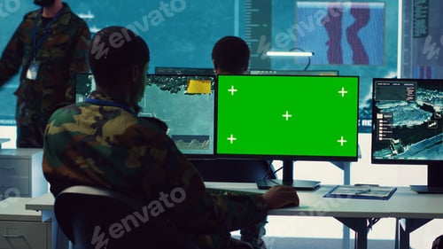 Preview: Intelligence analyst reviews ships activity next to an isolated mockup screen