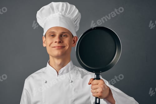 Preview: emotional chef with a frying pan in hand service work industry