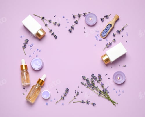Preview: Frame made with lavender flowers and natural cosmetic products on pink background. Space for text
