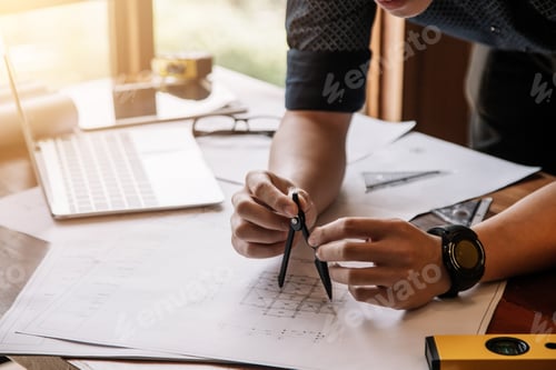 Preview: Construction engineering. Architect drawing blueprints and engineering tools on workplace.