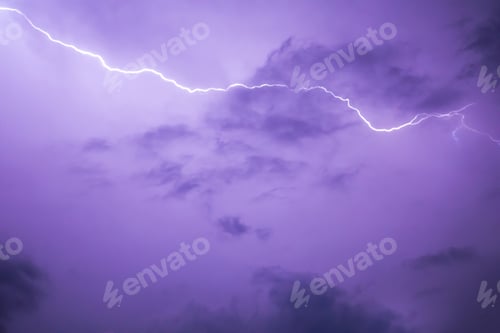 Preview: Lightning stroke in purple night sky