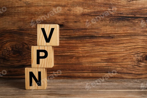 Preview: Cubes with acronym VPN on wooden table, space for text
